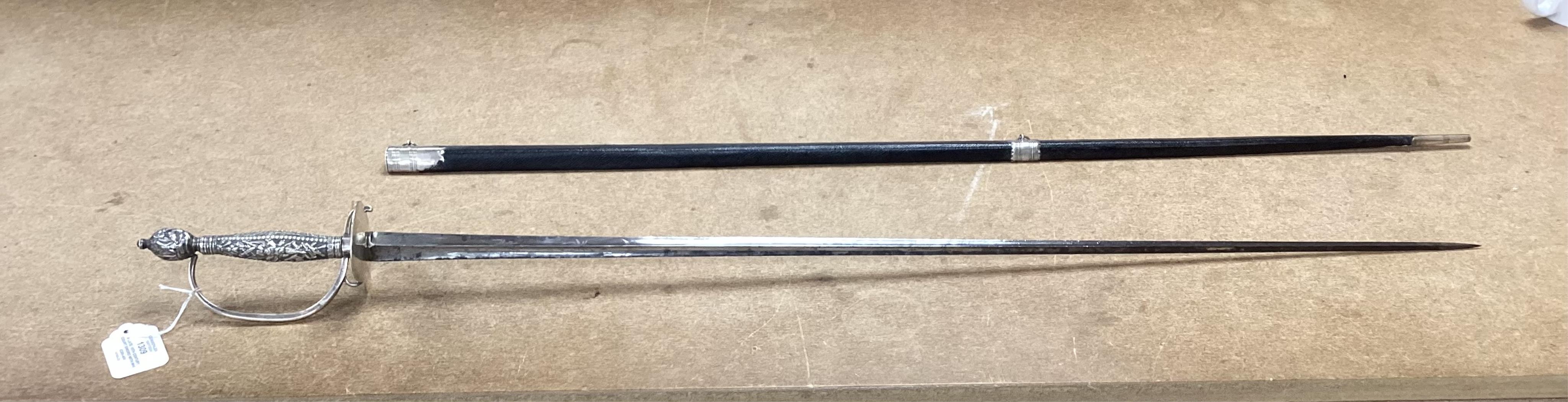 A late 18th century court sword with white metal grip, knuckle guard and mounts, decoration to scabbard band believe to be based on Admiral Duncan’s crest (Camperdown 1797), blade 84cm. Condition - fair to good, some wea